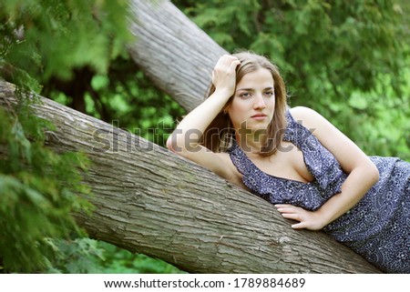 young woman on a tree