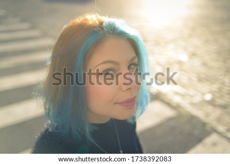 Similar – Image, Stock Photo Portrait of a laughing young woman with turquoise hair