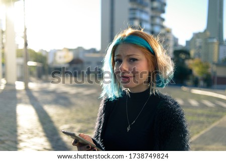 Similar – Image, Stock Photo Young woman with turquoise hair and piercings smiles