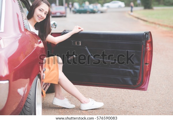 young woman opened the car\
door