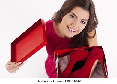 Young Woman Opening A Shoes Box