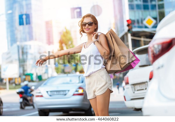 Young woman out shopping\
in the city.