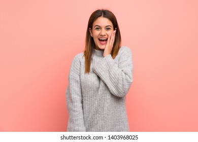 Young woman over pink wall with surprise and shocked facial expression - Shutterstock ID 1403968025