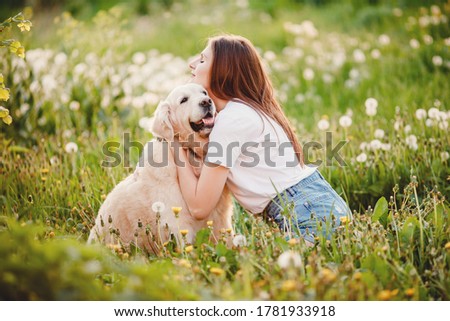 Similar – Happy smiling dog with its pretty young owner