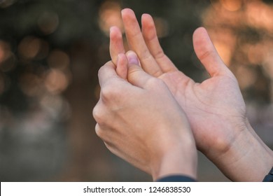 Young woman with pain on finger  - Shutterstock ID 1246838530
