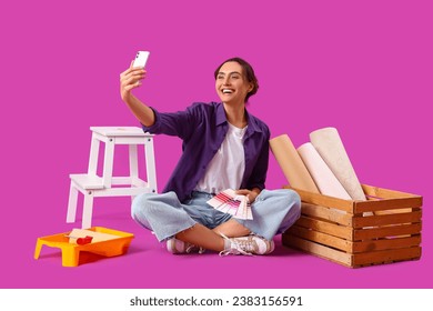 Young woman with paint color palettes taking selfie on purple background - Powered by Shutterstock