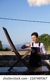 Young Woman Painting Cladding Wooden Chair In Outdoor, DIY Home Improvement.