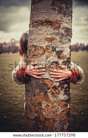 Similar – hands of woman hugging a tree