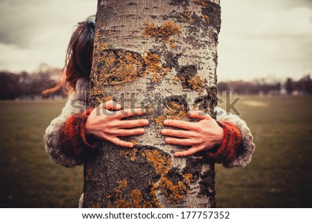 Similar – hands of woman hugging a tree