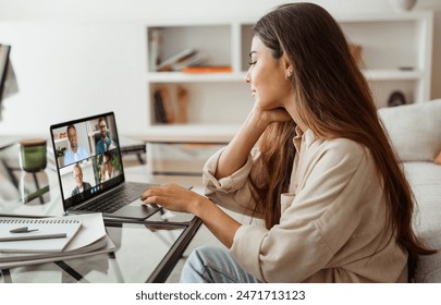 Young Woman Participating in a Virtual Business Meeting While Working at Home Office. Telecommunication Concept - Powered by Shutterstock