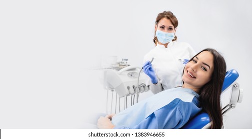 Young Woman Patient And Dentist