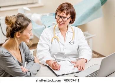 Young Woman Patient With A Senior Gynecologist During The Consultation In The Office