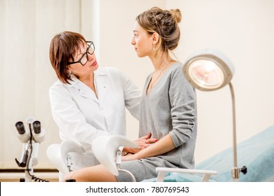 Young woman patient with a senior gynecologist during the consultation in the gynecological office - Shutterstock ID 780769543