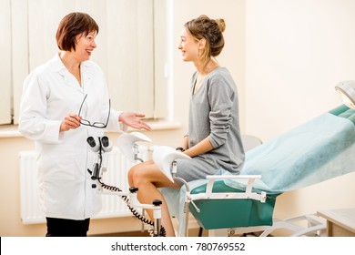 Young woman patient with a senior gynecologist during the consultation in the gynecological office - Shutterstock ID 780769552