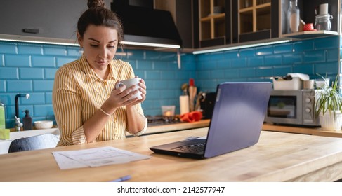 Young Woman Paying Bills Online