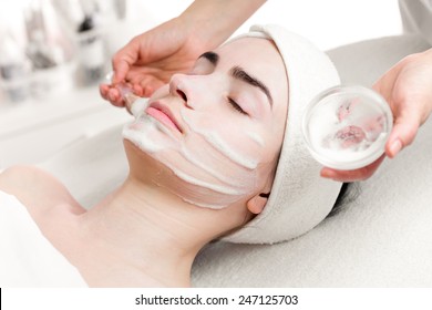 Young Woman Peeling Foam Mask Applying On Face