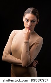 Young woman performing contemporary dance in photography studio