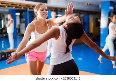 Young Woman Performing Heel Palm Chin Strike During Self Protection Training.