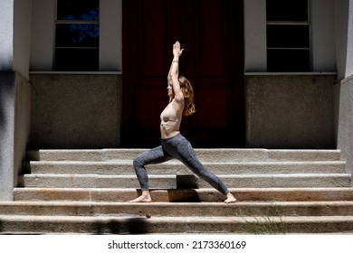 young woman performing yoga in forest - Shutterstock ID 2173360169