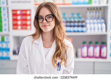 Young Woman Pharmacist Smiling Confident Standing At Pharmacy