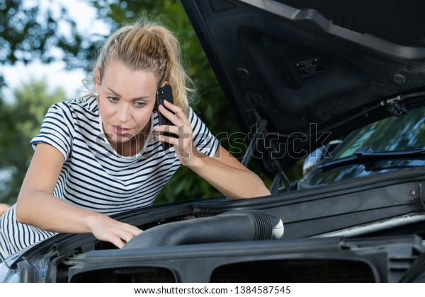 young woman phoning for\
assistance