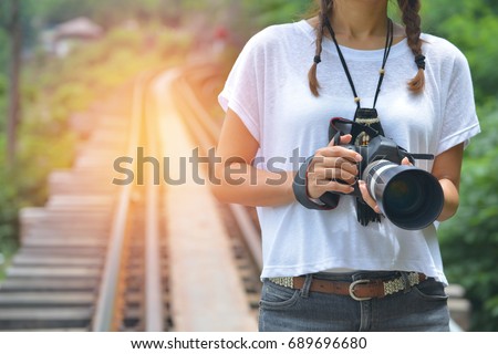 Young woman photographer Travel on public railways (Outdoor)