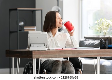 Young Woman With Physical Disability Drinking Coffee In Office