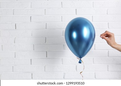 Women popping balloons