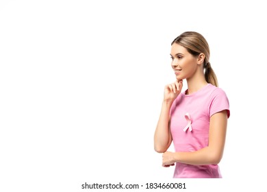 Young Woman With Pink Ribbon Of Breast Cancer Awareness On T-shirt Looking Away Isolated On White