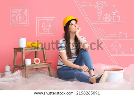 Young woman planning design of their new home Imagine de stoc © 