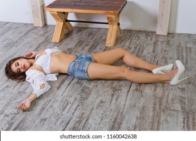 young woman playing crime scene on the ground