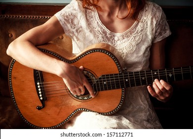 Young Woman Playing Guitar