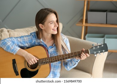 Young Woman Playing Guitar Home Stock Photo 1569849700 | Shutterstock