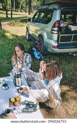 Similar – Image, Stock Photo Young women looking road map with vehicle on background