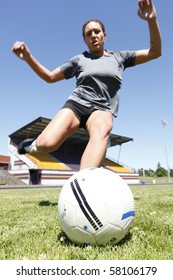 Young Woman Playing Soccer.