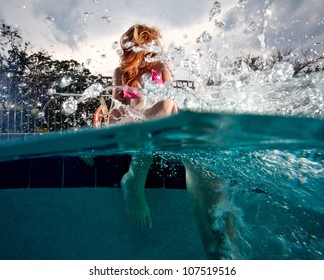 Young Woman playing and swimming in a Pool