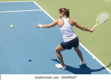 Young Woman Playing Tennis