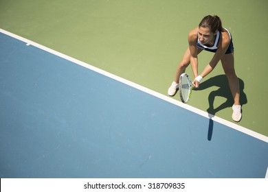 Young Woman Playing Tennis