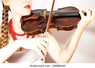 Young Woman Playing Violin And Wearing Traditional Polish Folk Costume