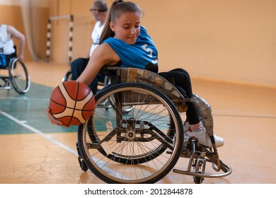 A Young Woman Playing Wheelchair Basketball In A Professional Team. Gender Equality, The Concept Of Sports With Disabilities. 