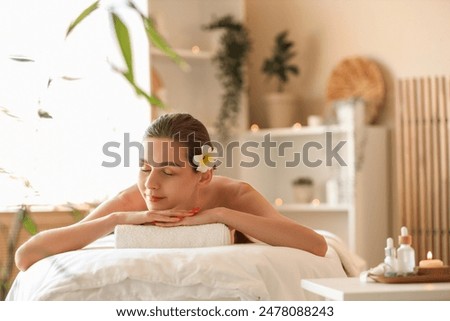 Similar – Image, Stock Photo Young woman relaxed on vacation, standing on the beach near mountains, in sunset light, smiling. Real people. Authentic image of real people.