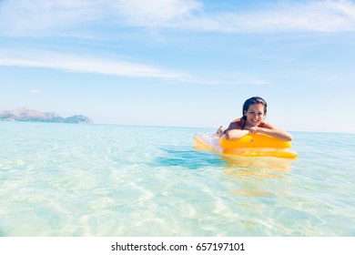 Young Woman With Pool Raft