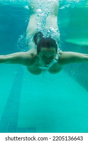 Young Woman In The Pool Underwater, Underwater Shooting