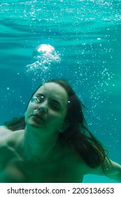 Young Woman In The Pool Underwater, Underwater Shooting