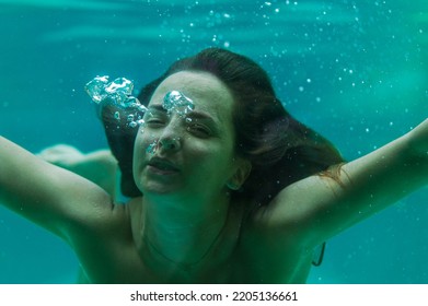 Young Woman In The Pool Underwater, Underwater Shooting