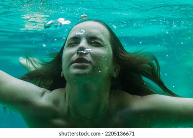 Young Woman In The Pool Underwater, Underwater Shooting