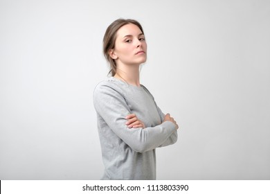 The Young Woman Portrait With Proud And Arrogant Emotions On Face. She Is Self Proud And Does Not Care About Other People