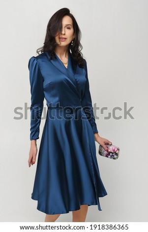 young woman in a posh stylish  dress vintage on a white background isolate