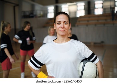 Young woman posing with basketball ball before womans match. - Powered by Shutterstock