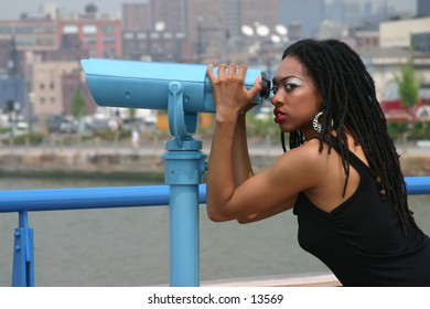 young woman posing near river